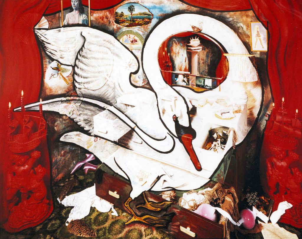 Collage of a swan trapped in a small room with miscellaneous objects and debris on the floor. The main colour used is red.