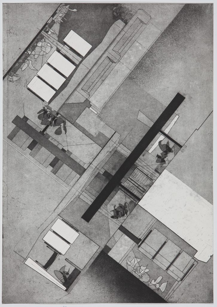 Black and white aerial photograph looking down at an open building exposing its floor plan.