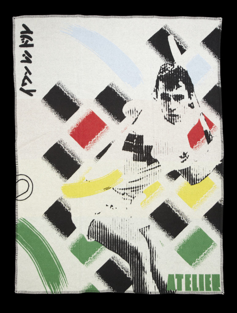 Blanket with a picture of a sportsman in black and white with multicoloured shapes in the background.