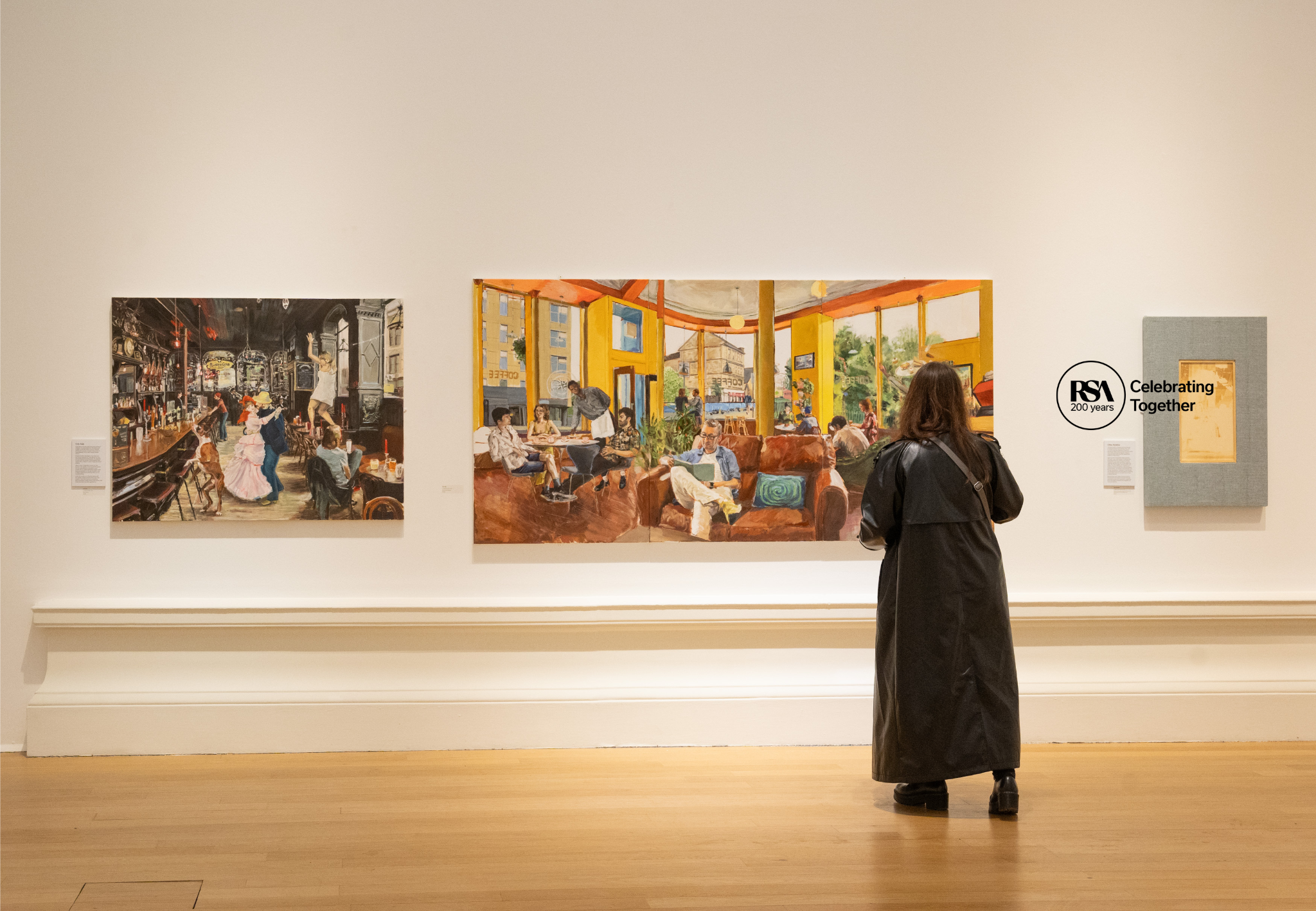 Person looking at art on wall